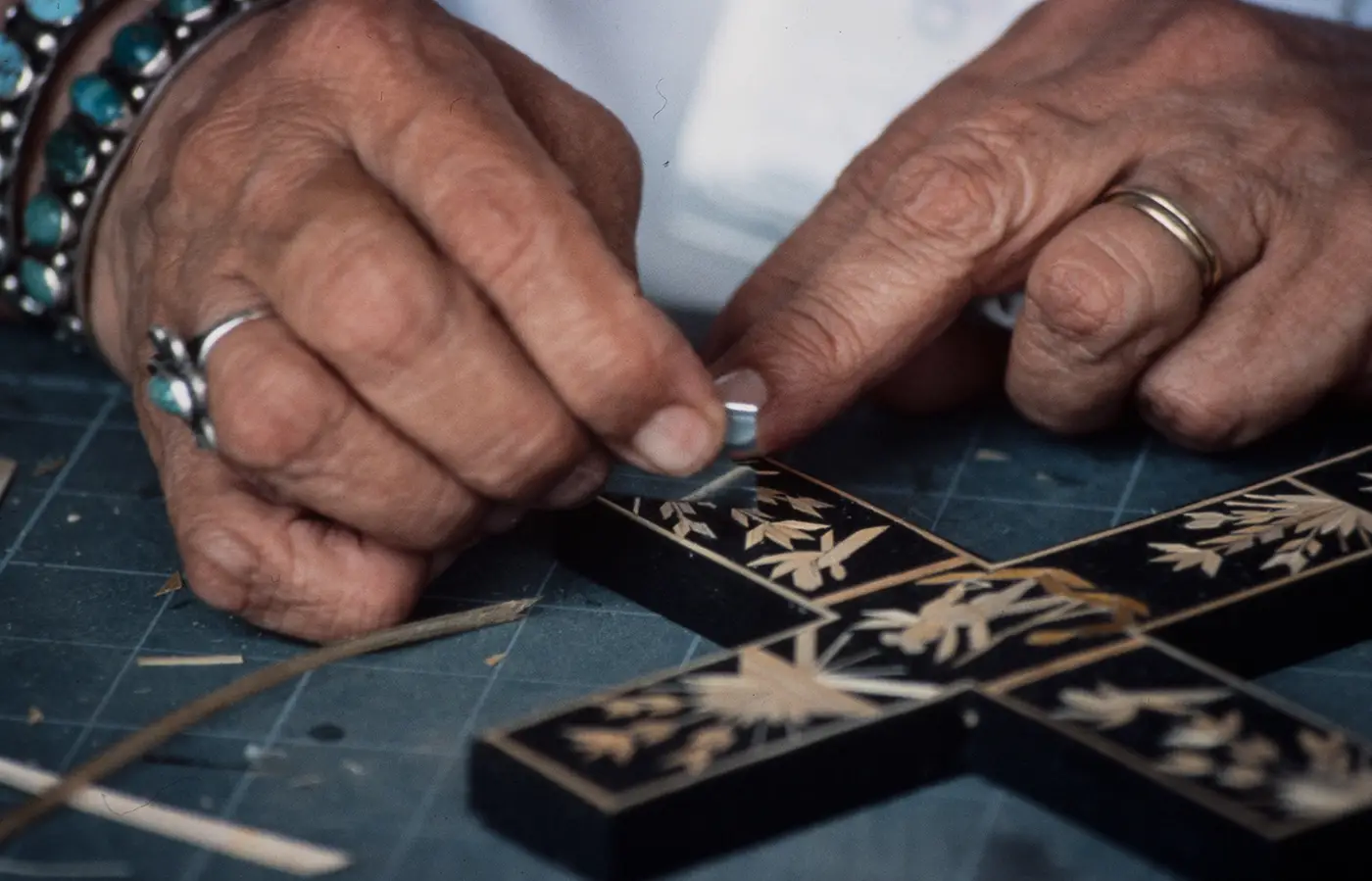 Paula Rodriguez decorates a cross