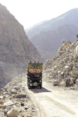 A decorated Pakistani cargo truck travels the Karakoram Highway towards China. These trucks move along the same routes taken by Silk Road travelers for thousands of years.
