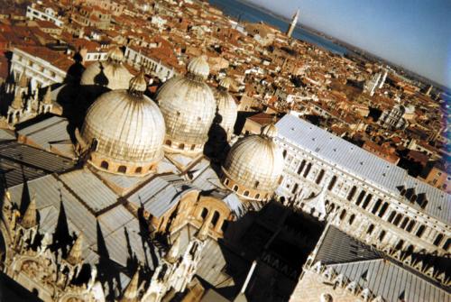 This view from the Campanile on St. Mark's Square looks across Venice from the Basilica towards the Arsenale. The Arsenale was the huge compound where ships of the Venetian fleet were built and refurbished. Houses from the 13th century are still inhabited