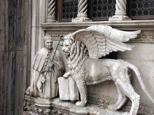 Francesco Foscari, a 15th-century doge of Venice, kneels before the Lion of St. Mark that is over the entrance to the Doge's Palace. The lion is the symbol of the city.