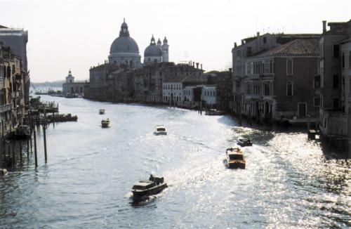 Motorized <i>vaporetti</i> now ply the Grand Canal that snakes through the center of Venice. The great houses of Venetian merchants line the canal.