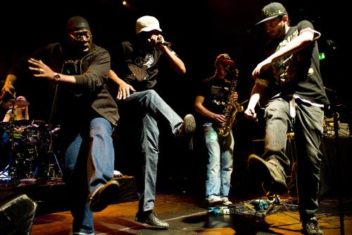 Rappers and hip-hop artists, such as Roots Manuva (shown here in white hat), are vital elements of African American oral culture. 