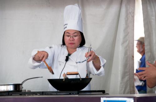 Evelyn S. Bunoan, owner and master chef of the Philippine Oriental Market & Deli in Arlington, Virginia, prepares a traditional Filipino dish at the 2010 Smithsonian Folklife Festival.