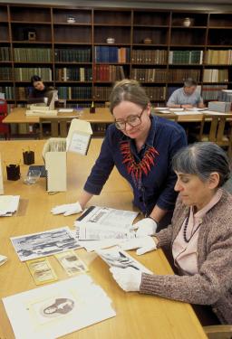 Paula Fleming (left) and Joanna Scherer research historic Native American photographs in the National Anthropological Archives at the Smithsonian's Museum Support Center in Silver Hill, Maryland.