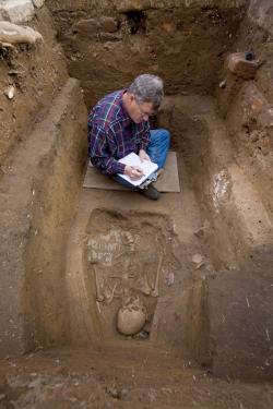Douglas Owsley, a forensic anthropologist at the National Museum of Natural History, examines skeletal remains in the field.