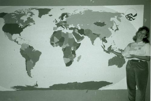 Barbara Jo White and one of the first world maps drawn in 1989.