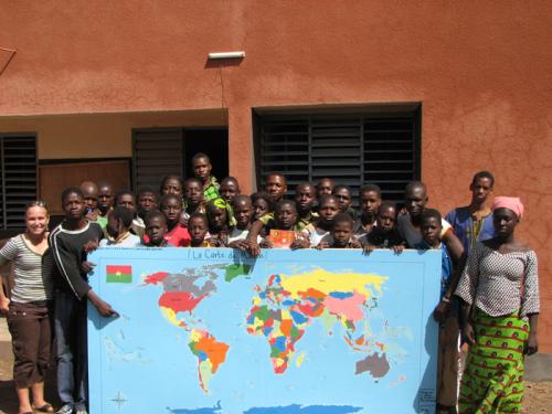 Peace Corps volunteer Stephanie Gottlieb and the world map drawn by her students in Burkina Faso.