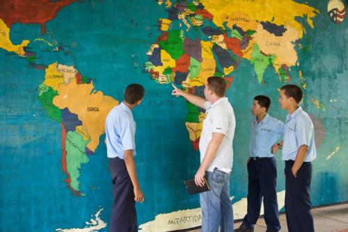 Peace Corps volunteer Rob Dawson and the world map drawn by his students in Panama.
