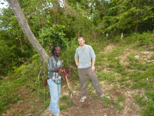 Brian Wedderburn (standing at left), president of the Bluefields Organic Farmers Group, and Patrick Marti, Peace Corps volunteer, prepare a small organic plot for planting.