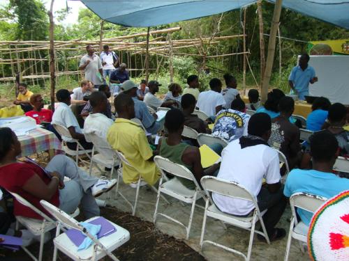 Raymond Martin (standing at right) leads a workshop for the Jamaica Organic Agriculture Movement on nutrient management.
