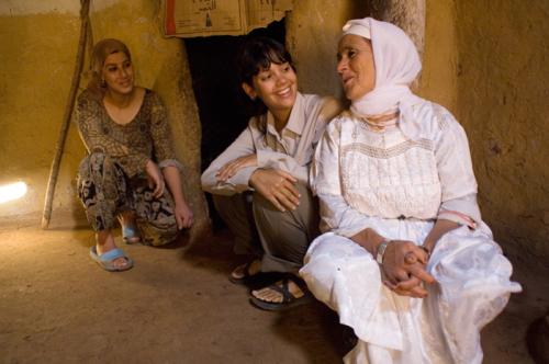 Peace Corps volunteer Sumona Majumdar (center) shares a laugh at home with her host mother and sister. Sumona served as an environmental volunteer, living in a remote mountain village in Morocco.