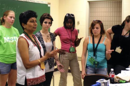 Anshu Varma teaches the art of <i>mehndi</i> at the 2009 annual statewide 4-H Exploration Days, where FOLKPATTERNS workshops teach 4-H youth about traditional arts and folklife.