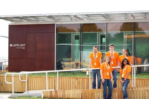 At the 2011 U.S. Department of Energy Solar Decathlon, students of the University of Tennessee, Knoxville, pose with the Living Light House. More than two hundred UT students across nine academic disciplines helped produce this innovative solar-powered ho