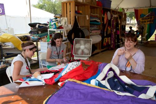 Volunteers care for a panel of The AIDS Memorial Quilt at the 2012 Smithsonian Folklife Festival.