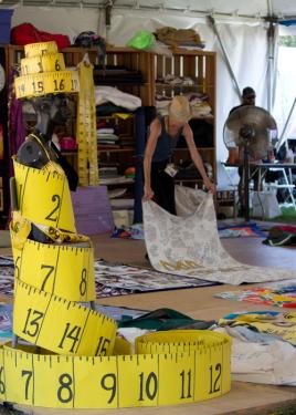 Quilt Production Manager Gert McMullin lays out panels at the 2012 Folklife Festival.