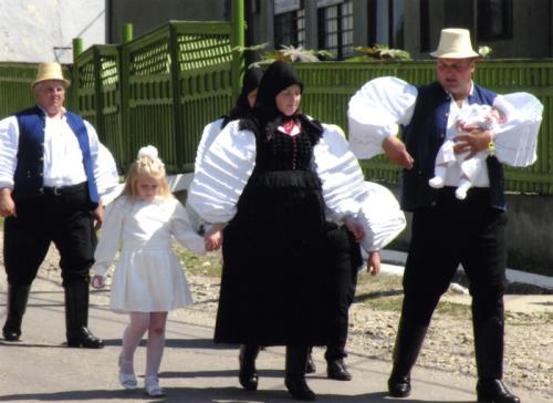 Parents and godparents in Sz&eacute;k, Transylvania (Romania), walk to the church for the baptism of their youngest child in 2005.