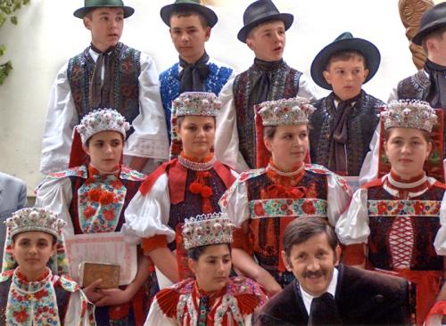 Young adults dress in traditional folk costumes for their first communion in the Kalotaszeg region of Transylvania (Romania) in 2006. In this most emblematic region of Hungarian folk art, churches encourage the preservation of folk costume for special eve