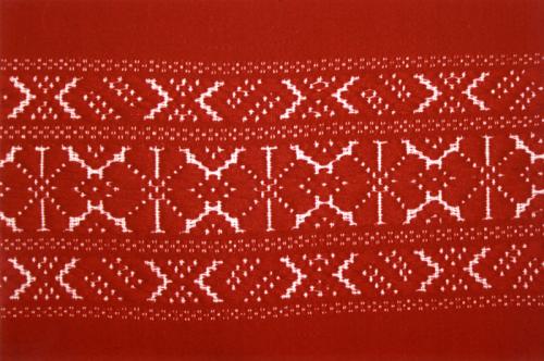 Homespun textiles from Kalotaszeg, Transylvania (Romania), frequently feature geometric designs on red cloth.