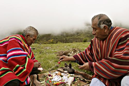 Kallawaya medicinal experts Walter Álvarez and Ramon Álvarez prepare a ritual table in a sacred place in Bolivia called Canlaya. UNESCO proclaimed the Andean Cosmovision of the Kallawaya a Masterpiece of the Oral and Intangible Heritage of Humanity in 200