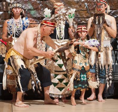 Alfred &ldquo;Bud&rdquo; Lane III of the Confederated Tribes of Siletz Indians in Oregon dances the traditional Feather Dance with his six year-old granddaughter Halli Chaabayu Lane-Skauge and other members of the Siletz tribe. A tribal leader, basketmake