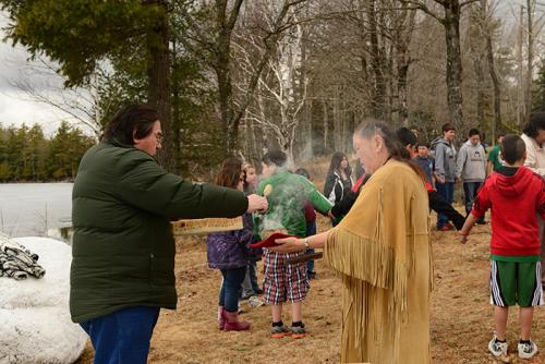 Passamaquoddy elder, culture expert, and language educator Wayne Newell and spiritual elder Joan Dana participate in a traditional Ice Out ceremony on the Passamaquoddy Reservation in Indian Township, Maine. Wayne Newell is a native Passamaquoddy speaker 