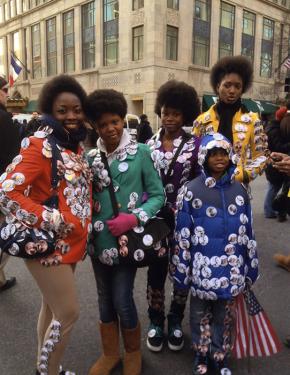 Young people at the 2013 inauguration of President Obama creatively adorn themselves with campaign buttons.