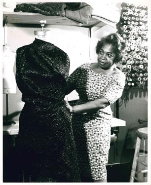 Designer Zelda Wynn Valdes demonstrates the art of draping on a dress form.