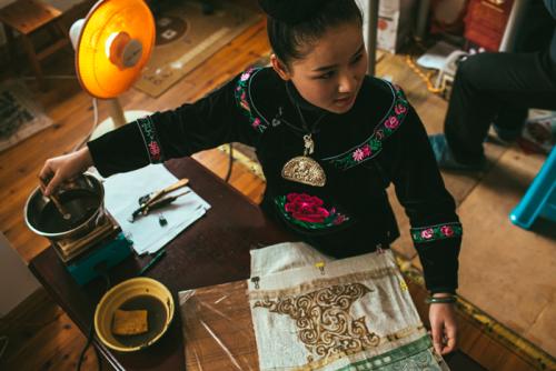 Liang Xiaoying is learning the batik process from Yang Wenbin, Leishan, Guizhou Province, 2014.