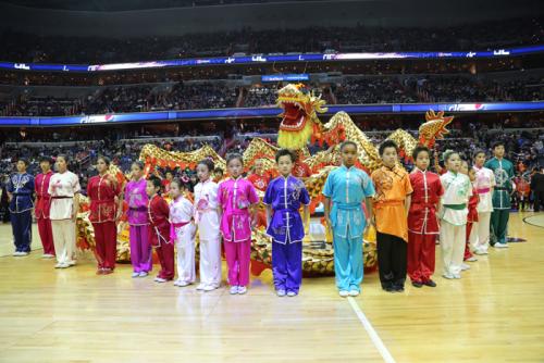 The U.S. Wushu Academy dragon dance team performs during the half-time show for a Washington Wizards game at the Verizon Center, Washington, D.C., 2014.