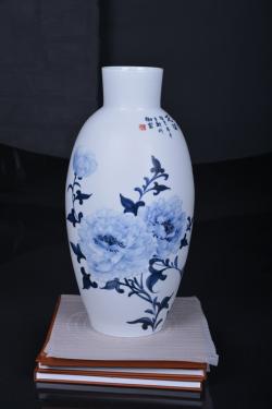 A painted porcelain vase by Sun Lixin.
