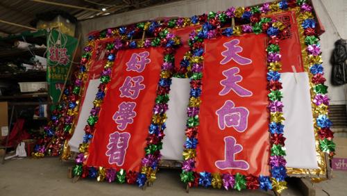 Decorative panels for the flower plaque await loading into the container that will transport them to Washington, D.C.
