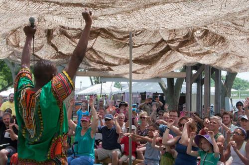 Newton Zadock Kweya encourages a full house to actively participate in his storytelling session.