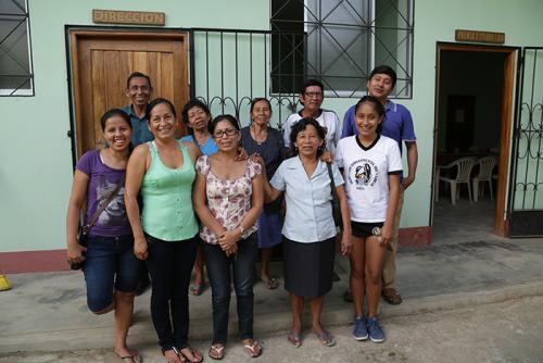 Teachers and producers from Radio Ucamara take a group photo outside the station in Nauta. They research and broadcast community engagement projects, including an initiative to revitalize their native language of Kukama.