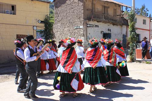 Performers dance and sing the Sarawja for the celebration of Holy Week in Carumas.
