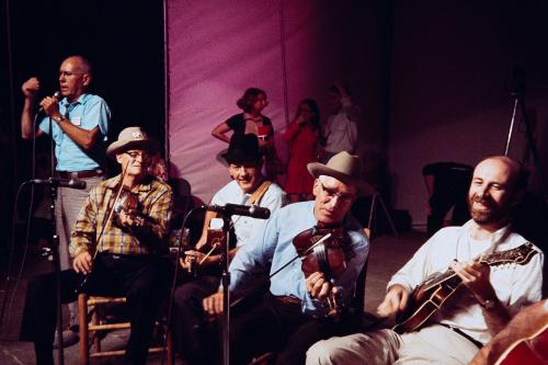 Ralph Rinzler (right) joins the Mainer-Morris-Ledford Band on the Main Stage at the 1969 Folklife Festival.