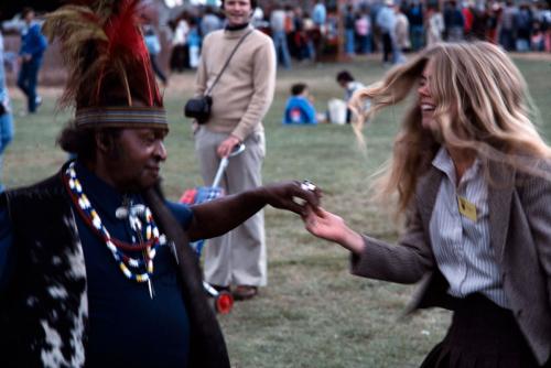 Folklife curator Marjorie Hunt dances with a participant at the 1978 Festival.