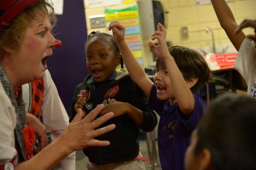 Second graders reenact the children's book Mirette on the High Wire by Emily Arnold McCully with clown Karen Bell.