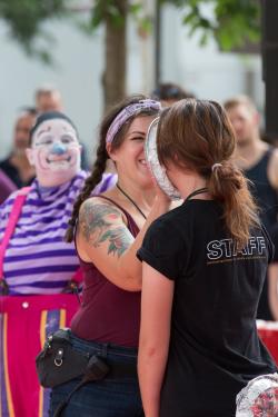 Program coordinator slams intern Michaela Podolny in the face with a pie.   