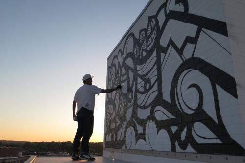 MASPAZ painting the roof of the Embassy Row Hotel. Photo by Cita Sadeli CHELOVE