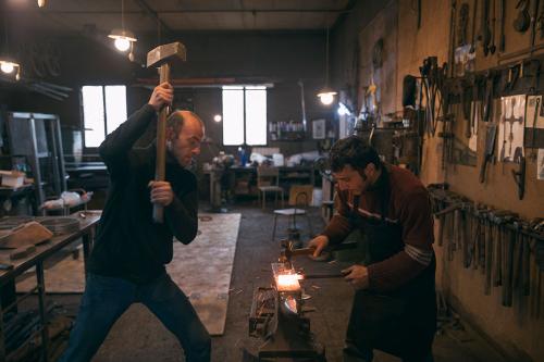 Garik Papoyan (left) and Hovhannes Mnoyan (right) work together on a piece. 