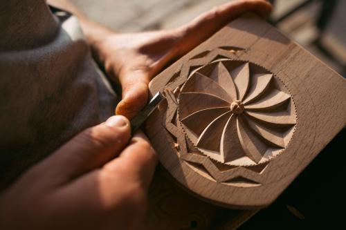 This spoon box features the circular eternity symbol, a popular adornment in Armenian carving. 