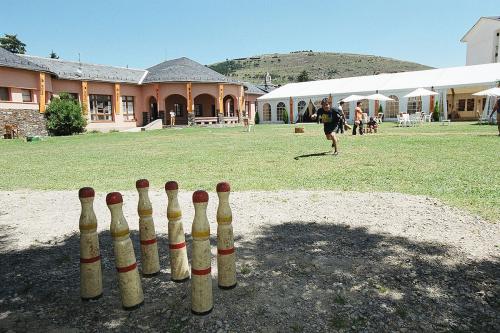 A child plays bitlles, a traditional Catalan game similar to bowling that dates back to 1376.