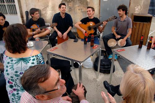 Musicians perform Catalan rumba, a music genre that developed in Barcelona’s Romani community in the 1950s.