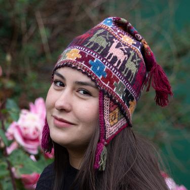 A woman in a dark red hat.