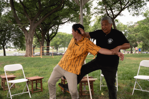A frame animation of Kumu Ramsay Taum demonstrating martial arts with Kalewa Correa, with Taum pulling Correa’s arm while pushing his hand down on Correa’s neck.