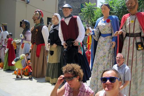 Megan Marlatt in Catalonia, with various giants standing behind her