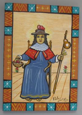 A small painting depicts the Holy Child of Atocha sitting in a blue cloak and holding a staff with a water gourd and basket in his other hand. The frame consists of orange and blue geometric details.