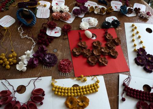 A table set with earrings, necklaces, hairpins, and other accessories.