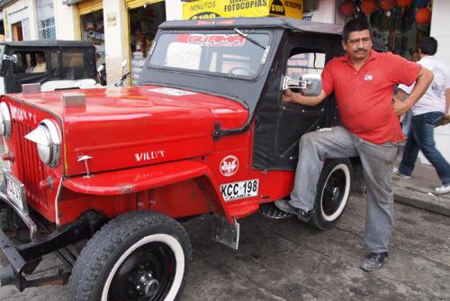 Guama standing by his jeep, photo by Cristina Diaz-Carerra, Smithsonian Institution