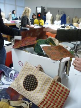 Samples of resusable bag materials in the foreground, the design studio in the background.